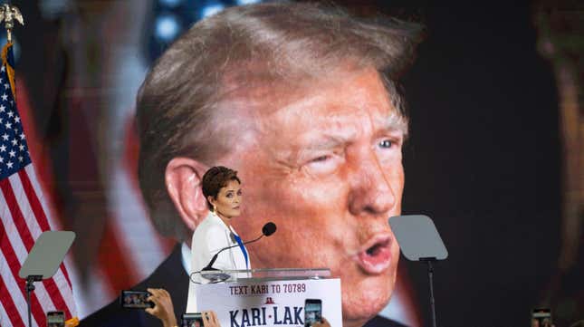 SCOTTSDALE, ARIZONA - OCTOBER 10: Former Republican gubernatorial candidate Kari Lake watches a pre-recorded video of former President Donald Trump give Lake his endorsement in the race for the seat U.S. Sen. Kyrsten Sinema (I-AZ) at JetSet Magazine on October 10, 2023 in Scottsdale, Arizona. Lake will face Democratic challenger and U.S. Rep. Ruben Gallego (D-AZ). (Photo by Rebecca Noble/Getty Images)